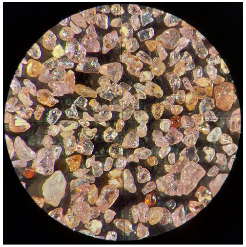 Coarse garnet products under microscope